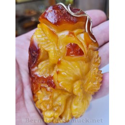 Amber pendant carved