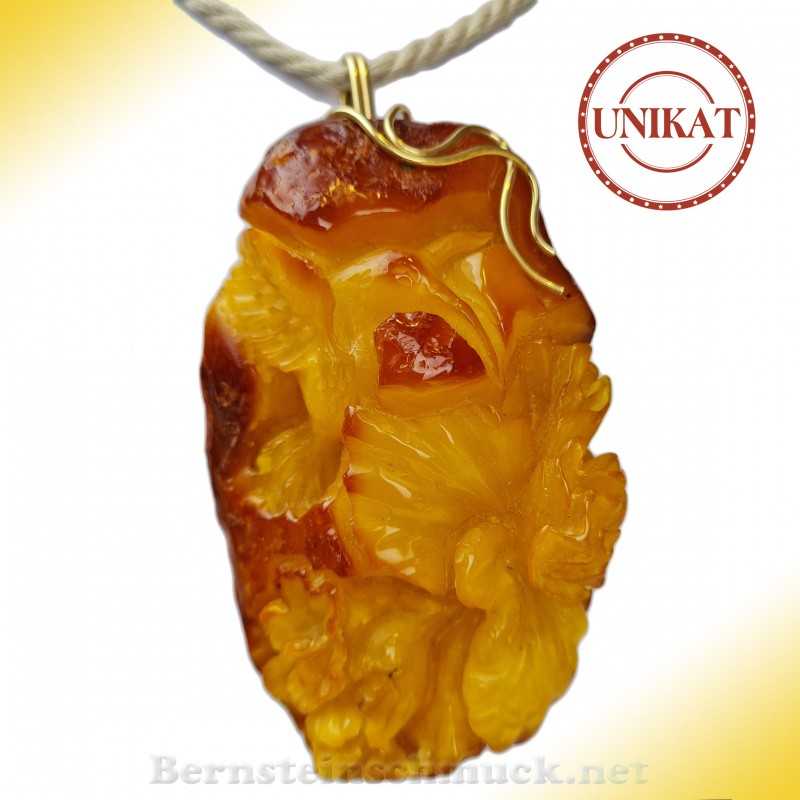Amber pendant carved